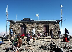 Hikers resting at the summit hut on the 2018 open gate day