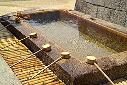 Shinto rituals begin with a process of purification, often involving the washing of the hands and mouth at the temizu basin; this example is at Itsukushima Jinja.