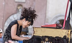 Hiromi Uehara Japanese jazz pianist and composer known for her virtuosic playing and innovative fusion of jazz, classical, and progressive rock elements in her music.