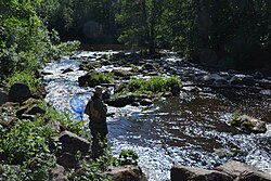 A fisherman on the rapids in Nukari, Nurmijärvi, Finland
