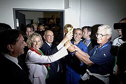 Italian President Giorgio Napolitano congratulates coach Lippi and captain Cannavaro after the final match against France.