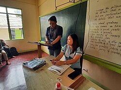 Student teacher with his cooperating teacher from the Philippines