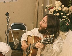 John Lennon rehearsing the anti–Vietnam War anthem "Give Peace a Chance" (1969)