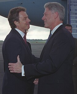 U.S. President Bill Clinton greets British Prime Minister Tony Blair in 1998. Both were influential Third Way leaders of the 1990s.