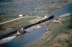 Tug and barge passing through the Colorado River Locks on the Gulf Intracoastal Waterway near Matagorda, Texas