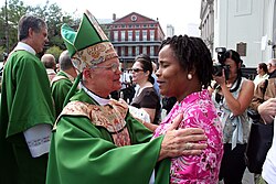 Archbishop Hughes greets parishioners at St. Louis Cathedral after the first liturgies in New Orleans since Hurricane Katrina (2005)