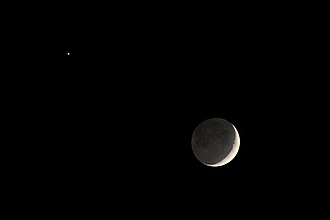 Earthshine reflected from the Moon during conjunction with Venus (left)