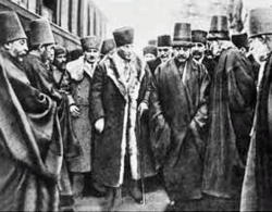 Mustafa Kemal in 1923, with members of the Mevlevi Order, before its institutional expression became illegal and their dervish lodge was changed into the Mevlana Museum. The Mevlevi Order managed to transform itself into a non-political organization which still exists.