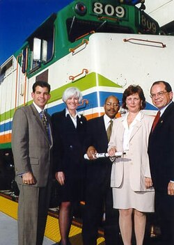 Alex Penelas (mayor of Miami Dade, at furthest left) with other officials at a February 1999 press conference announcing a federal funding grant for Tri-Rail improvements