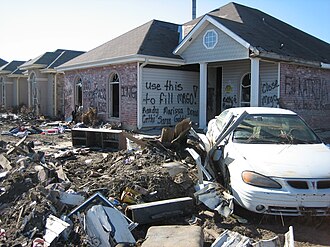 Inscription on house in storm-surge devastated neighborhood of Chalmette, Louisiana suggests that the ruins be used to fill MRGO.