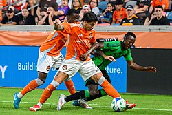 Franco Escobar challenges Austin FC's Osman Bukari for the ball in 2025