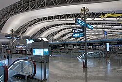 4th floor ticketing hall, illustrating the terminal's airfoil roof