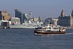 A Mersey Ferry (foreground) with the Liverpool waterfront in the distance
