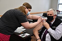 Parson receiving his COVID-19 vaccine in February 2021