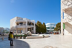 Architect Richard Meier chose beige-colored Italian travertine panels to cover the retaining walls and to serve as paving stones for the arrival plaza and museum courtyard.[18]