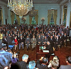 President Johnson speaks to a television camera at the signing of the Civil Rights Act in 1964