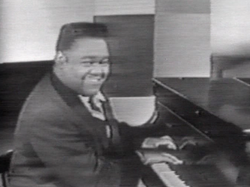Domino singing "Blueberry Hill" on The Ed Sullivan Show in 1956