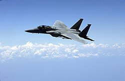 F-15A 75–057 in service with the Florida Air National Guard flying over Florida with AIM-9X and AIM-120 missiles loaded