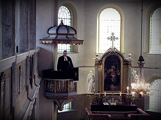 A Lutheran priest delivers a sermon during the celebration of the Mass at the Church of Peace in Jawor, Poland
