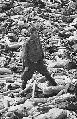 Fritz Klein, later executed for atrocities, amid a pile of victims at Belsen. He was interviewed for the documentary.