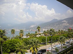 Promenade of İskenderun (old name: Alexandria of Cilicia) seeing the Nur Mountains (old name: Amanus) in the background.