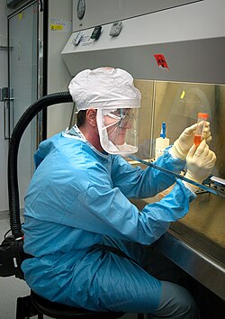 Dr Terrence Tumpey examines a reconstructed version of the Spanish flu virus at the CDC