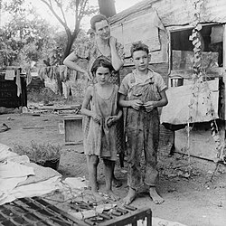 An impoverished American family living in a shanty, 1936