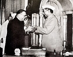 B. R. Ambedkar presenting the final draft of the Constitution of India to Rajendra Prasad in November 1949