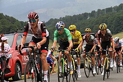 Mikkel Bjerg, Wout van Aert (in green jersey), Jonas Vingegaard (in yellow jersey) and Tadej Pogačar behind (in white jersey)