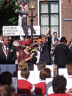 Queen Beatrix and her son and heir Willem-Alexander, Prince of Orange (waving) visit Woudrichem in 2007.