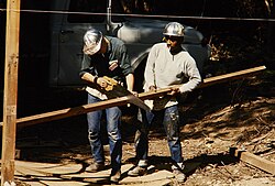 Two men working for Job Corps, a program established by the Economic Opportunity Act of 1964
