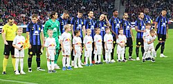 Inter players line up before a pre-season friendly against Salzburg in August 2023.