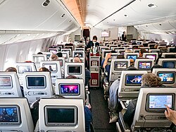 Economy Class seats (equipped with Oryx One in-flight entertainment screens) on a Boeing 777-300ER