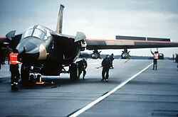 Ground crew prepares an F-111F of the 48th Tactical Fighter Wing for a retaliatory air strike on Libya