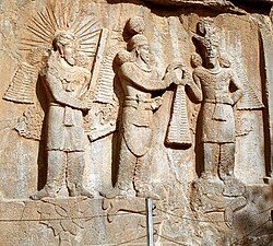 Investiture of Sassanid emperor Shapur II (center) with Mithra (left) and Ahura Mazda (right) at Taq-e Bostan, Iran