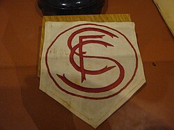 Sevilla's first crest, displayed on a former player's shirt in the club museum