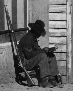 African-American corporal (United States Colored Troops) outside 8 Whitehall Street, Atlanta, a slave auction house; Fall 1864