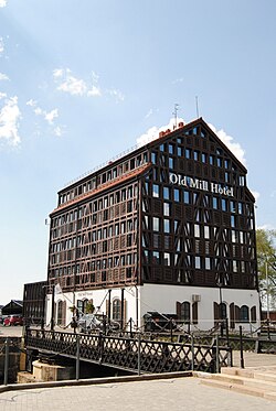 The Old Mill Hotel, Klaipėda, built in 2008, has glass curtain wall combined half-timber framing.[58]