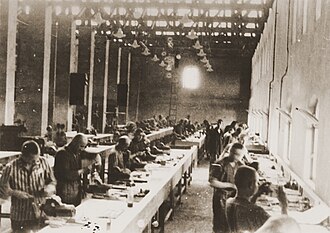 Prisoners around 1944 working at a Siemens factory in KZ Bobrek, a subcamp of Auschwitz concentration camp[21]