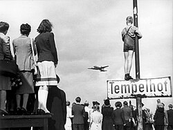 German civilians watching Western supply planes at Berlin Tempelhof Airport during the Berlin Airlift
