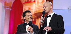 Zelenskyy (left) and Yevhen Koshovyi (right) co-hosting the opening portion of Teletriumph 2011, the national television awards of Ukraine. Kvartal 95 wrote the script and hosted the 2011 ceremony.