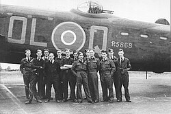 83 Squadron aircrew in front of their Lancaster R5868, Squadron Leader Shailendra Eknath Sukthankar, an Indian Navigator stands in the middle.