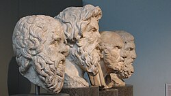 The carved busts of four ancient Greek philosophers, on display in the British Museum. From left to right: Socrates, Antisthenes, Chrysippus, and Epicurus.