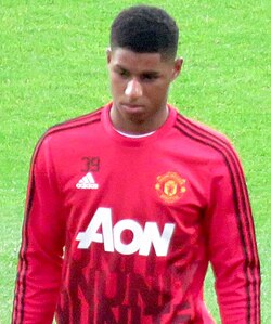 Rashford warming up for Manchester United in 2016