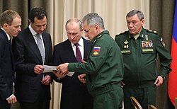 Assad with Vladimir Putin, Sergei Shoigu, and Valery Gerasimov in 2017 during the Russian intervention in the Syrian civil war