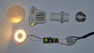 Disassembled LED lamp with switched-mode power supply circuit board and Edison screw