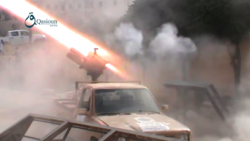 Sham Legion multiple rocket launcher mounted on a technical launches rockets at YPG positions in Aleppo, 2 October 2015.