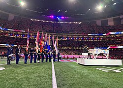 Jon Batiste performed the national anthem at the game