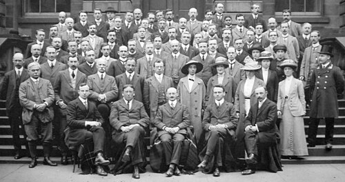 The 1913 Colloquium for the Edinburgh Mathematical Society. Whittaker is featured sitting at the far left end of the front row.