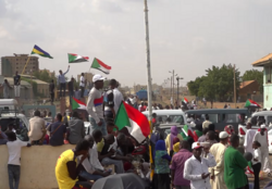 People with flags during the Sudanese revolution (2018–2019)